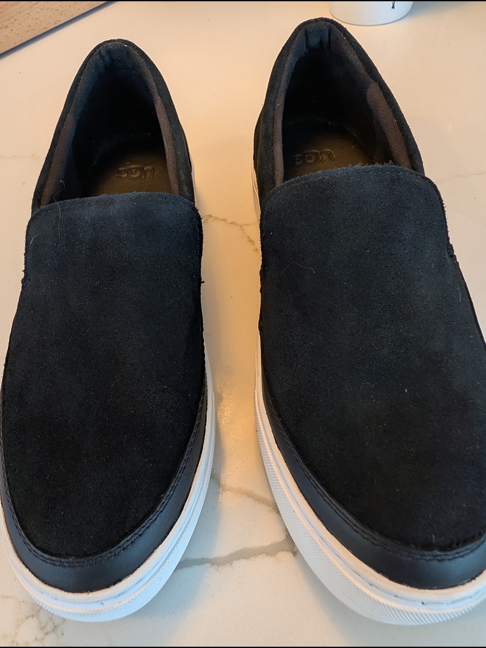 UGG Women’s Black Suede Slip-On Loafers with White Sole